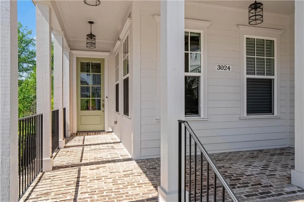Property entrance featuring covered porch