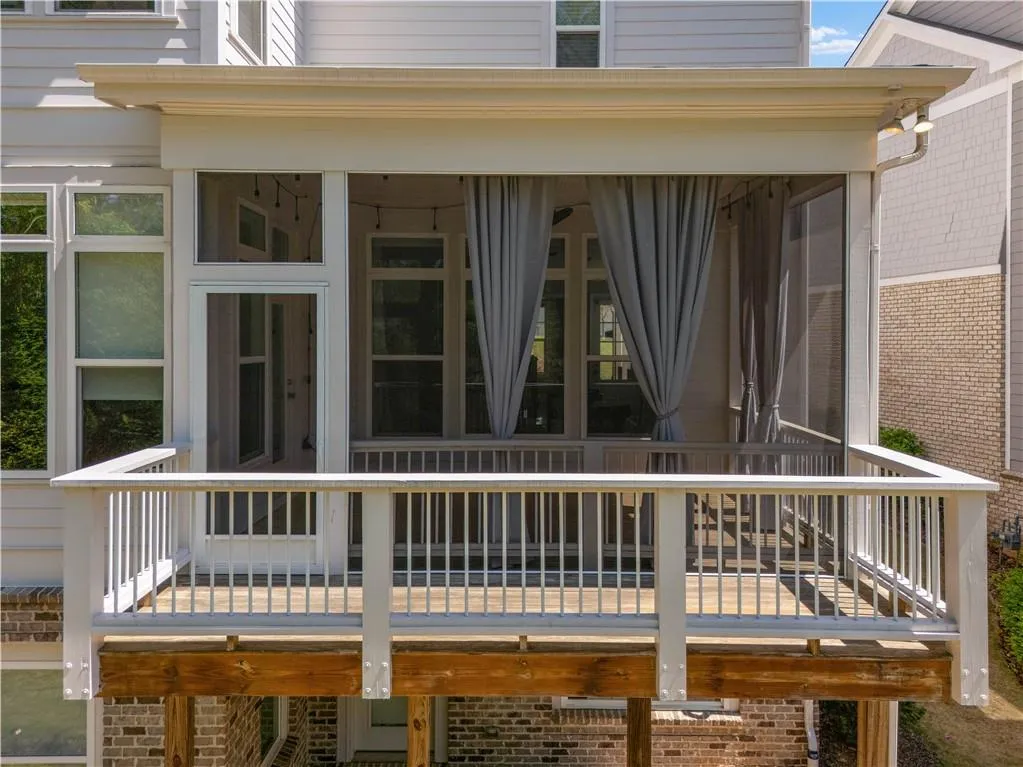 Wooden deck with a sunroom