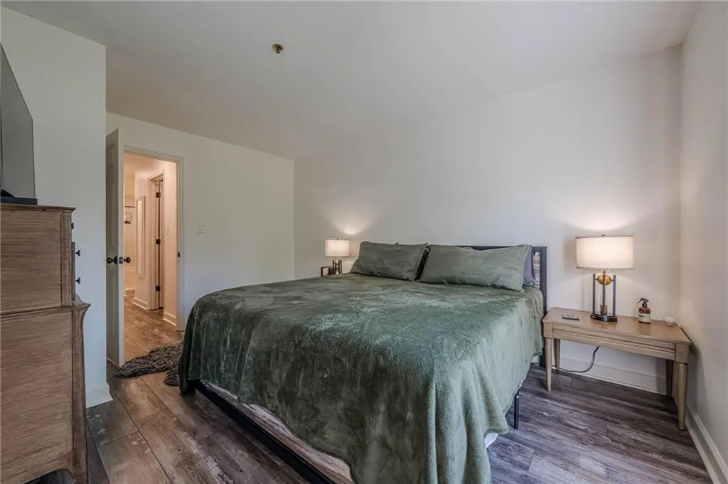 Bedroom with dark wood finished floors