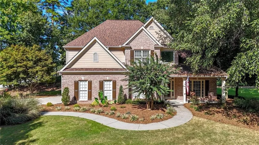 Brick and siding exterior with a gabled roof