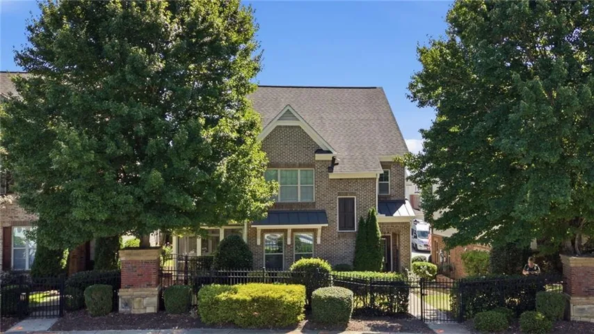 Brick exterior with dark roof and gables