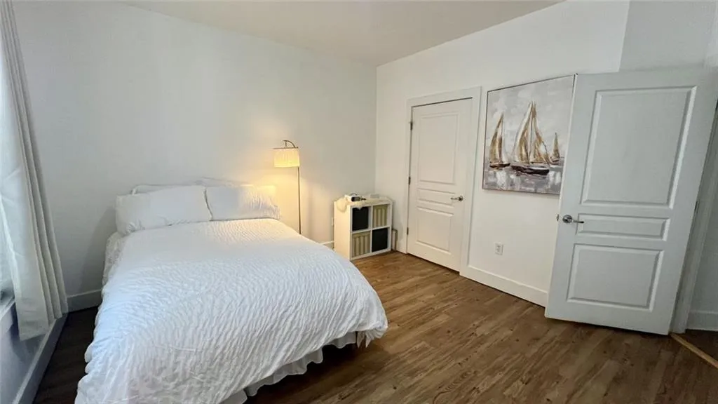 Primary bedroom featuring new flooring