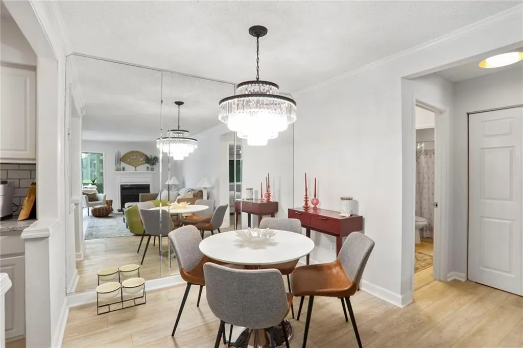 Dining area featuring new flooring and paint flooring, ornamental molding, and baseboards