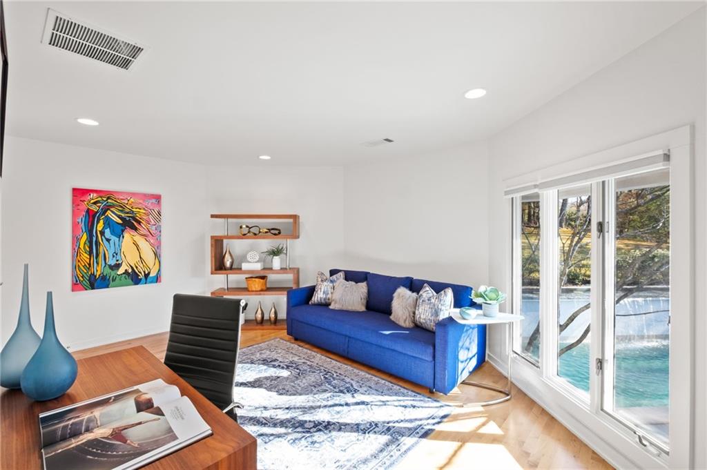 Office off of owner's suite with access to pool and patio. Could be converted into a second walk in closet.