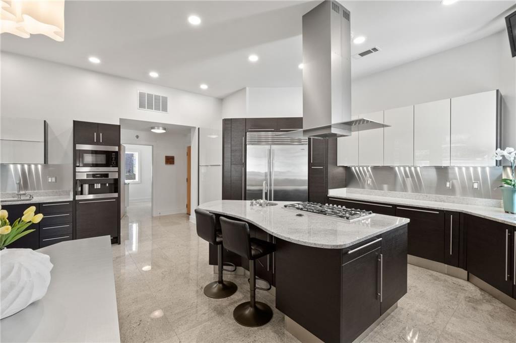 Kitchen with island and lots of natural light