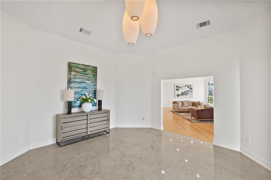 Grand entry way with stone flooring