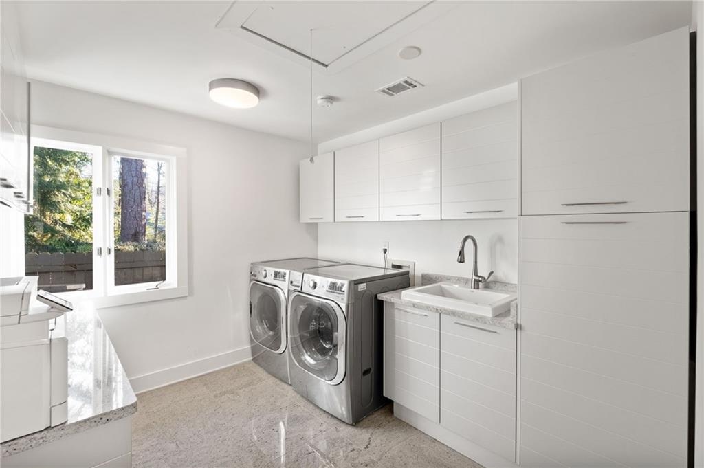 Large laundry room just off the garage, kitchen and patio