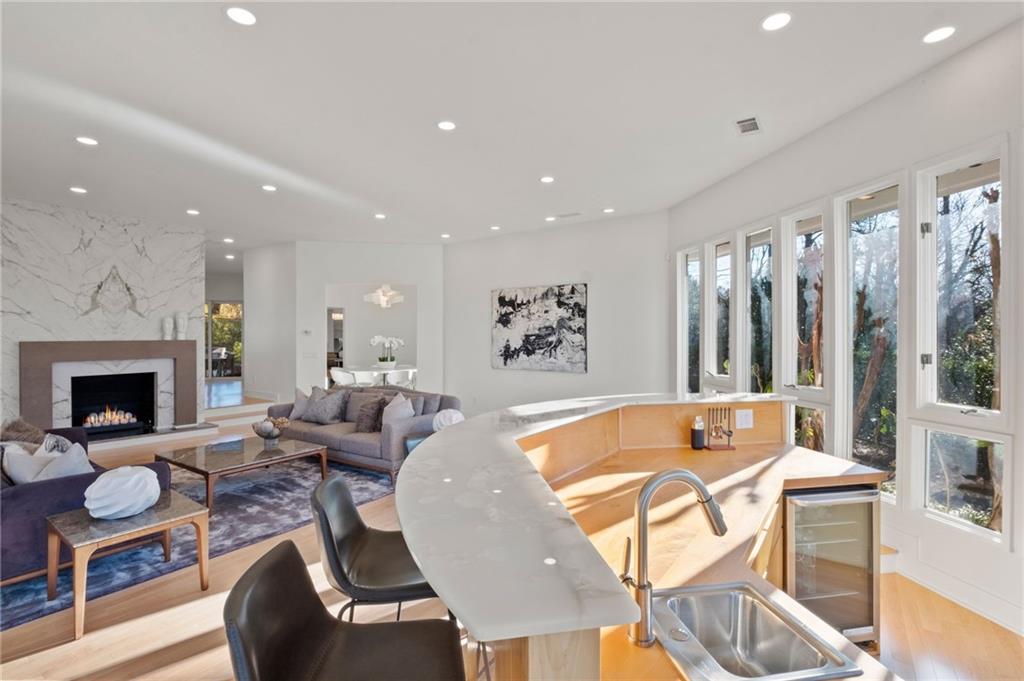 Wet bar that seats 6 with sink and beverage refrigerator