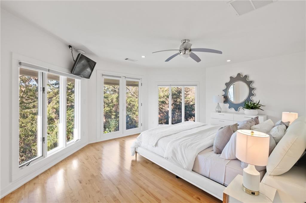 Secondary bedroom in the trees with large windows