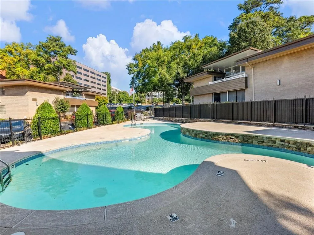 Community pool with a patio area