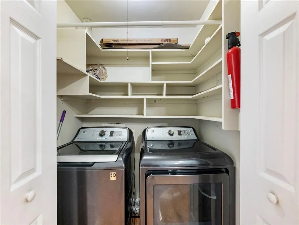 Laundry area featuring independent washer and dryer
