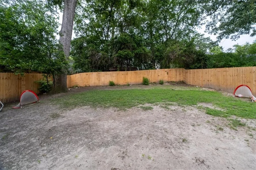 View of fenced backyard