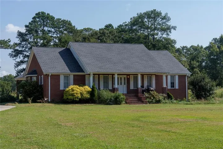 Four-sided brick with architectural shingle