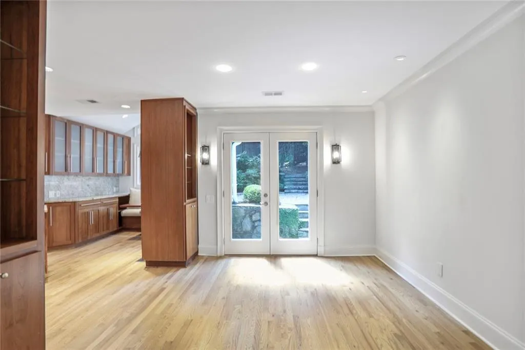 Entryway featuring french doors, light wood-style flooring, and recessed lighting