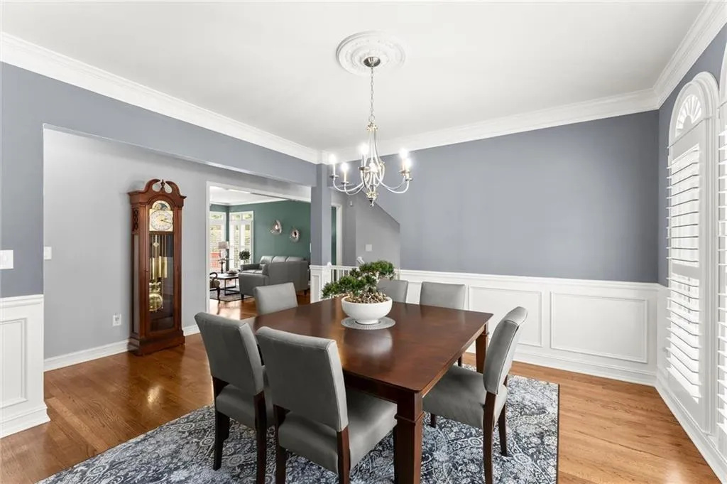 Dining Room has a view to the living room without being fully open  concept.