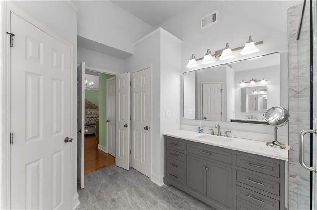 Master bath features his and hers vanities & his and hers closets.