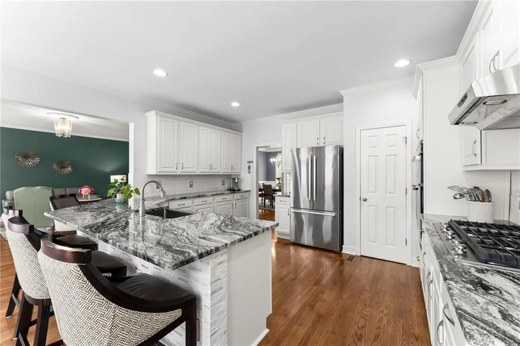 Kitchen features all new appliances, a new gas cook top & range hood.