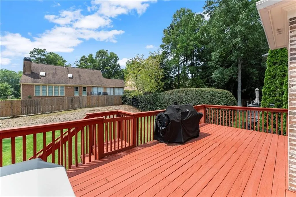 Deck overlooking spacious, private backyard