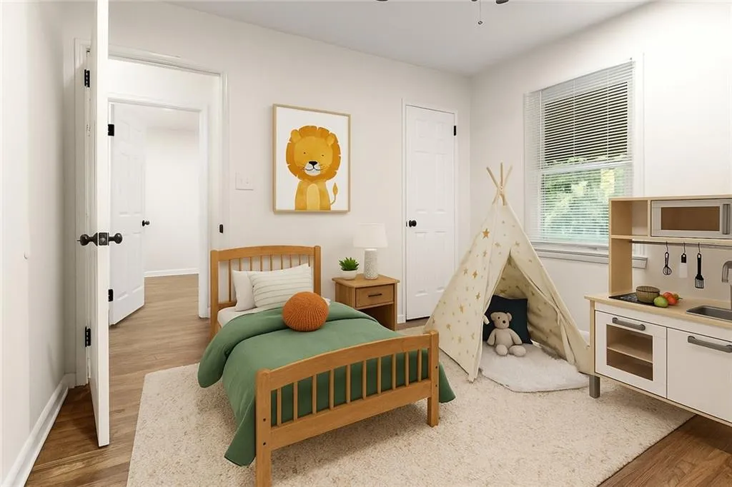 Bedroom with light wood-style flooring and a sink