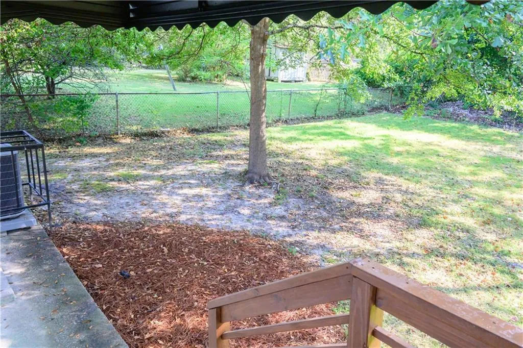 View of fenced backyard