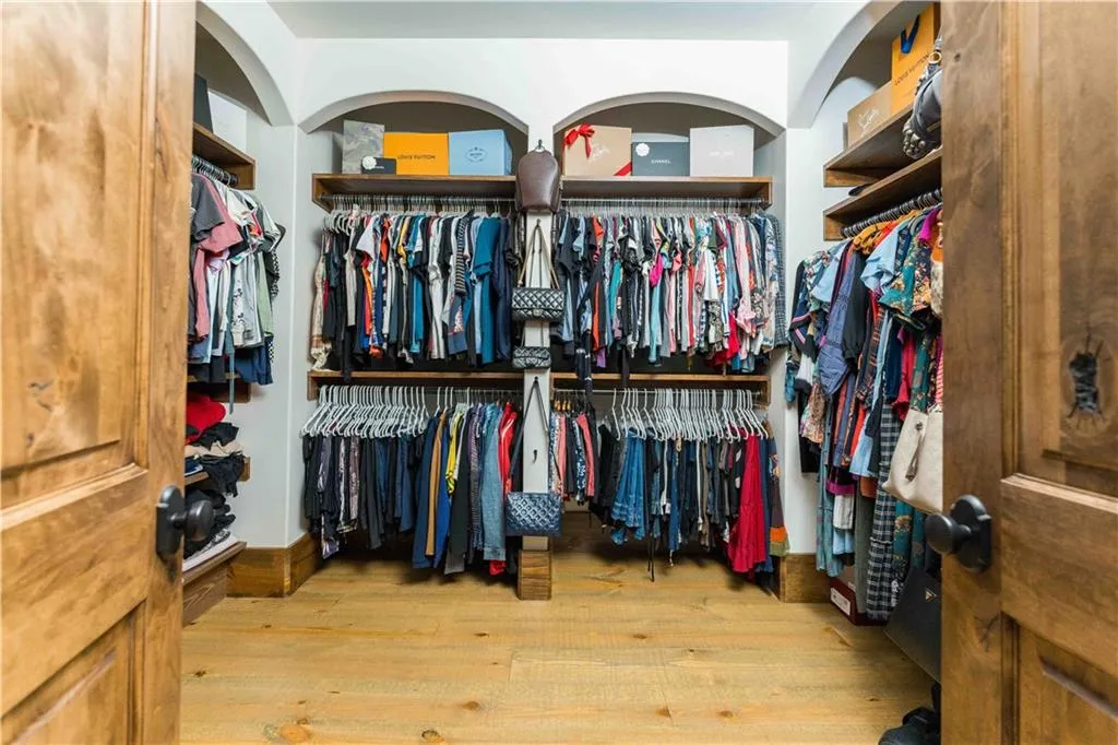 Walk in closet featuring light wood-type flooring
