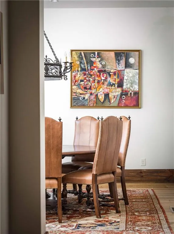Dining room with wood finished floors and baseboards