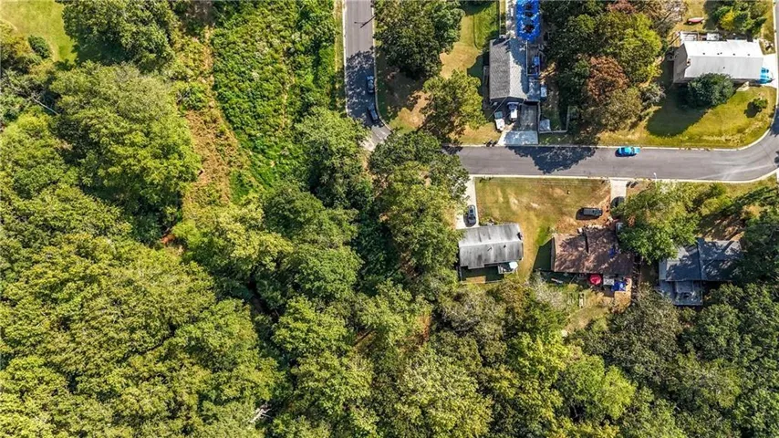 Expansive wooded lot offering privacy and natural surroundings