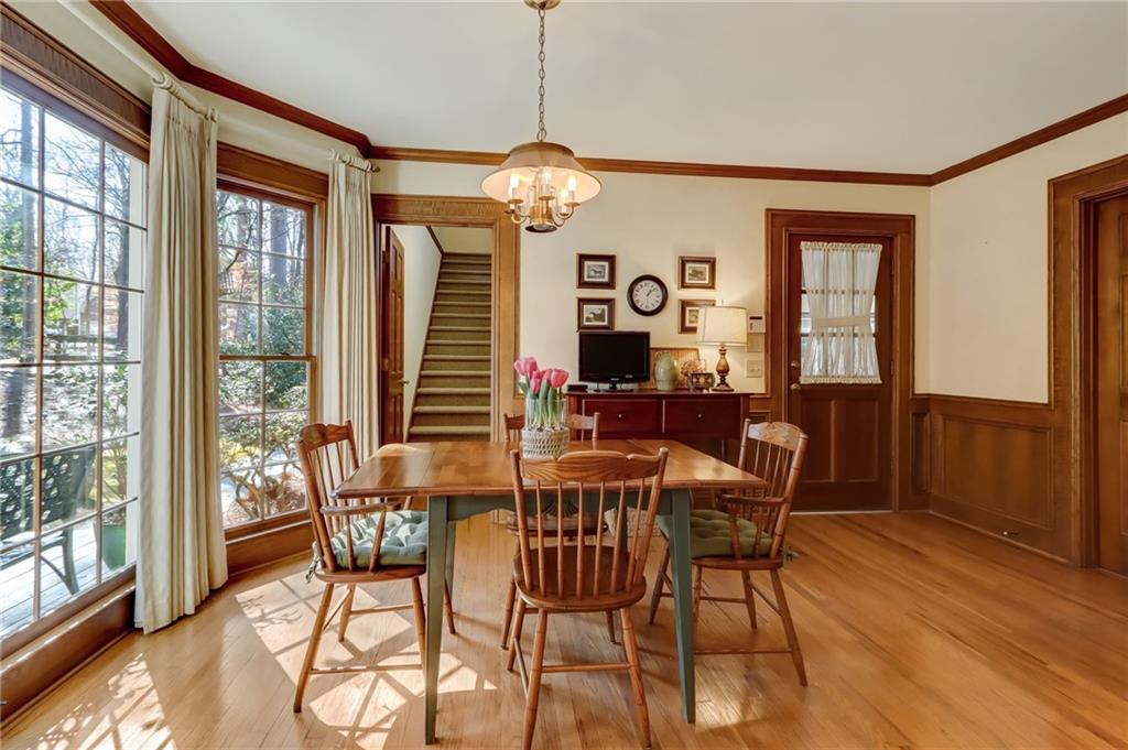 Sunroom / solarium featuring a wealth of natural light, ceiling fan, and lofted ceiling with skylight