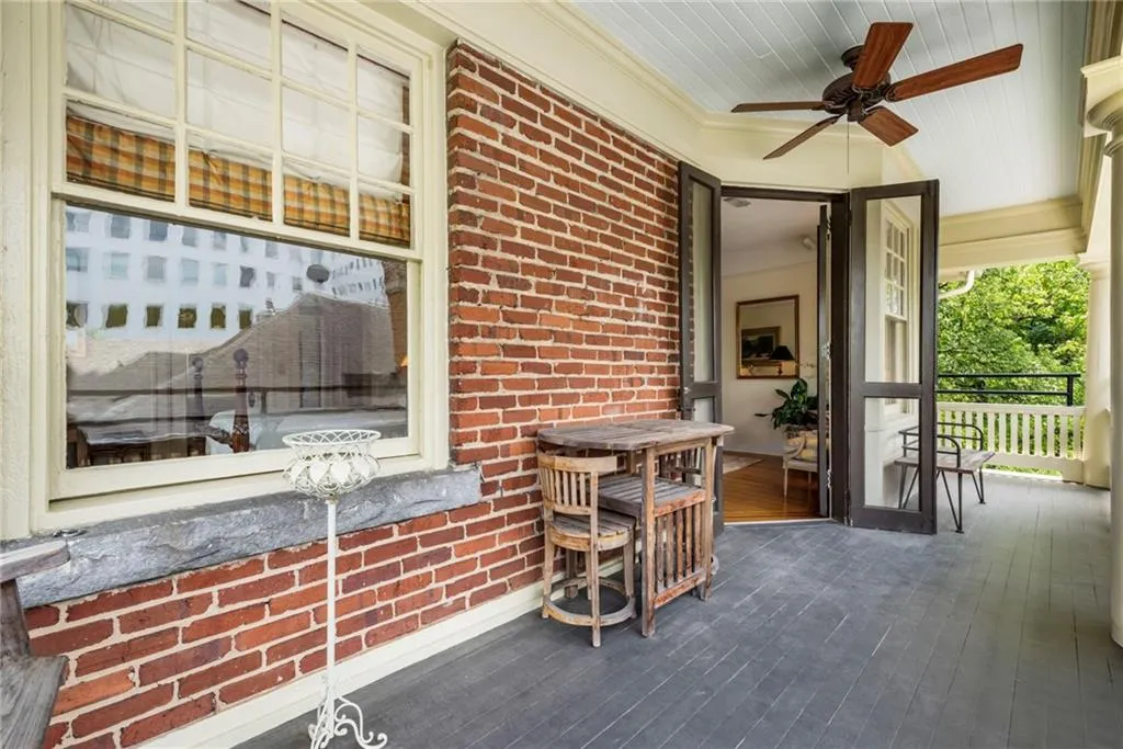 Covered porch with a ceiling fan