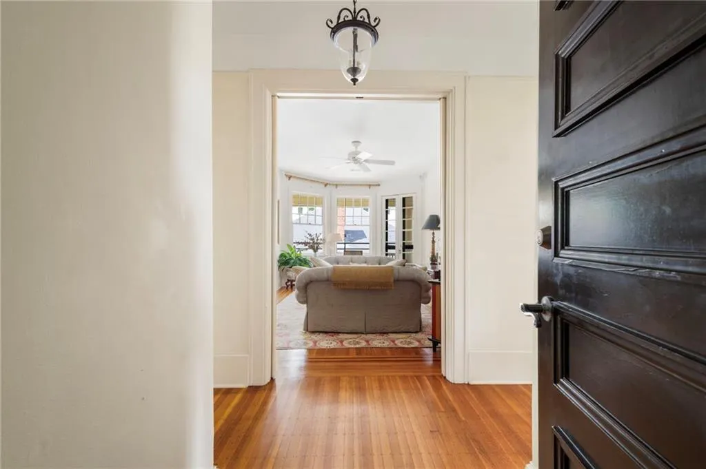 Hall featuring light wood-style floors and baseboards