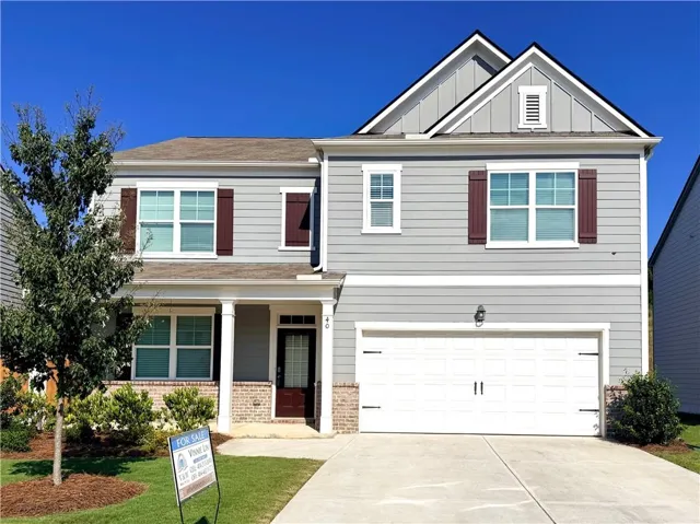 Two-story exterior with light gray siding and white trim