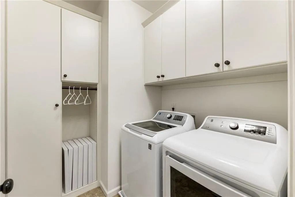 Laundry area with washer and dryer and cabinet space