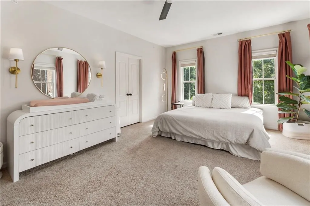 Bedroom with carpet and a ceiling fan