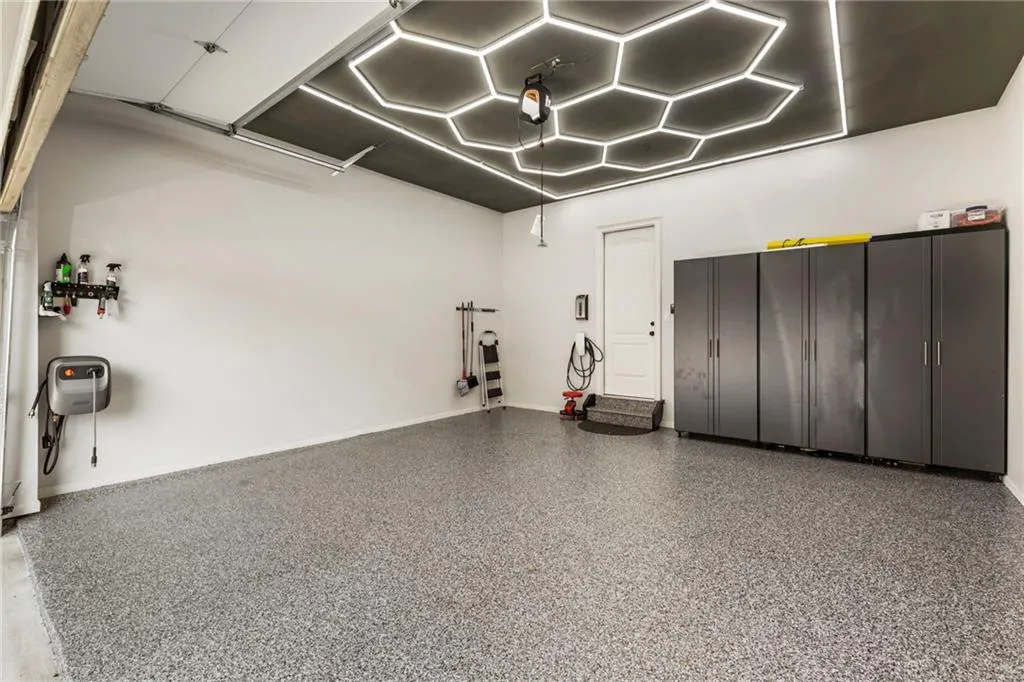Garage featuring baseboards