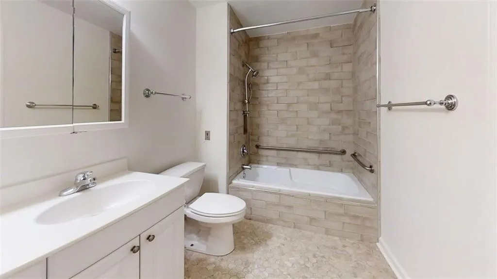 Bathroom featuring vanity and tiled shower / bath combo