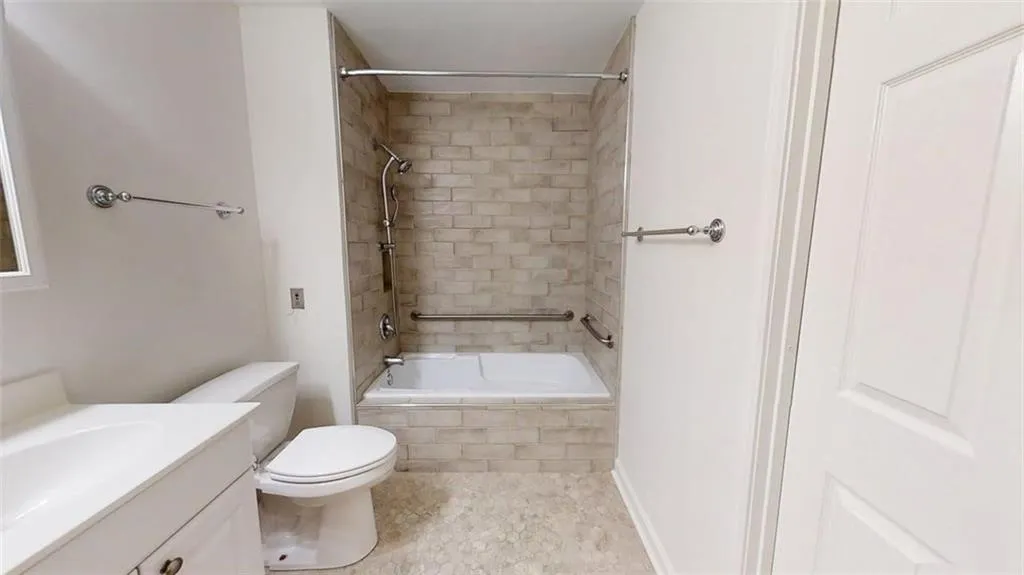 Bathroom featuring vanity and tiled shower / bath combo