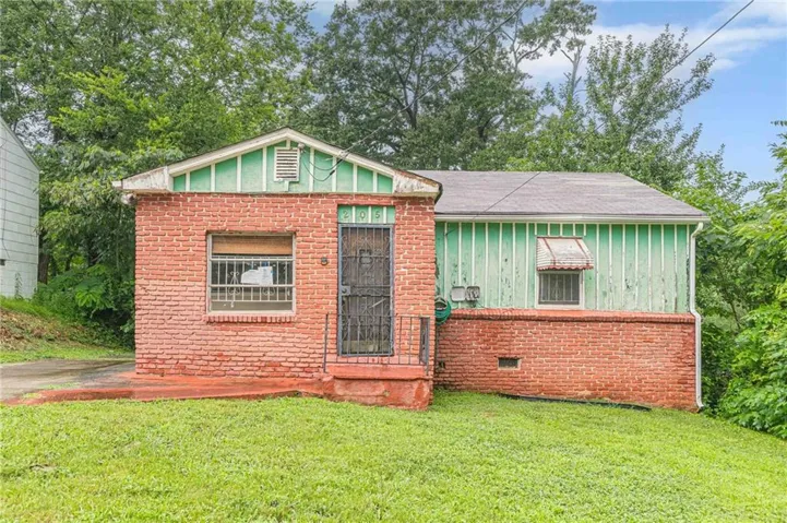 Brick and siding exterior with a partial brick facade