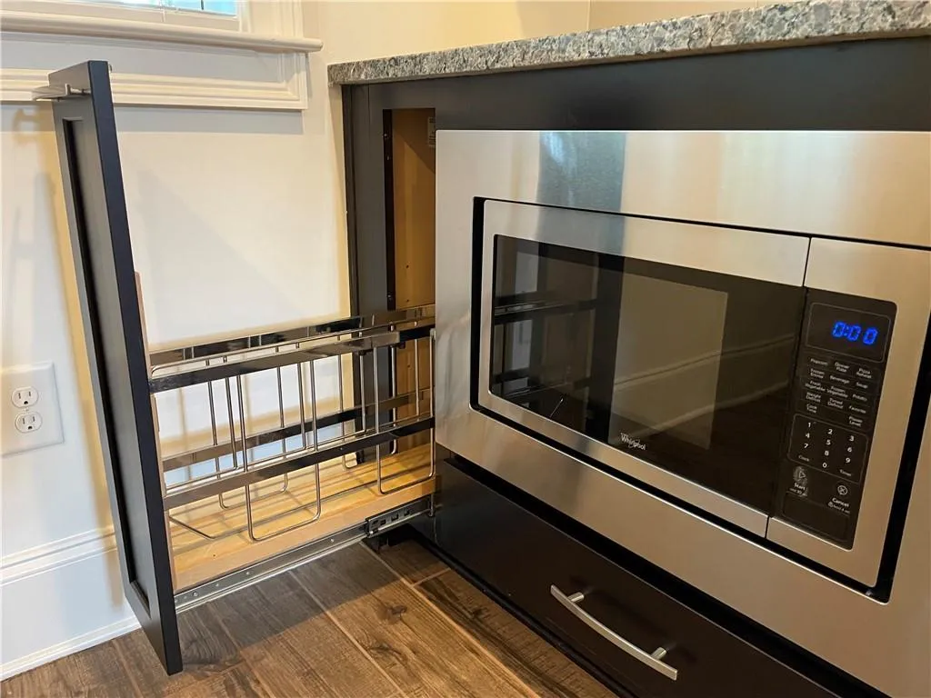Terrace level microwave and handy cabinet for large serving trays