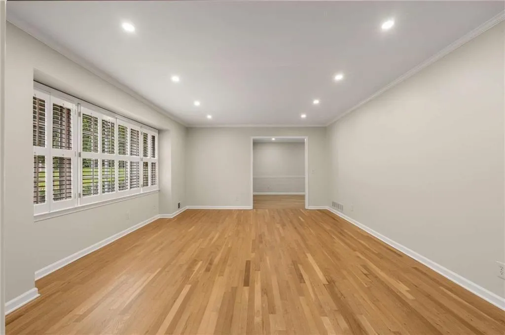 Refinished White Oak Hardwood Floors and Plantation Shutters.