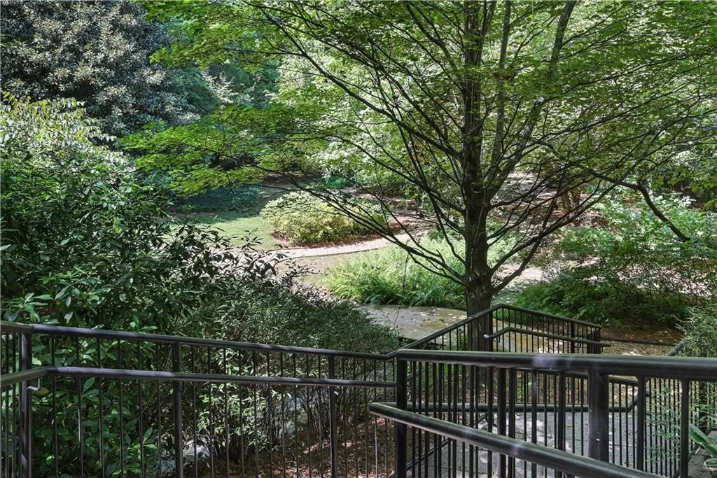 View of private greenspace and pathway behind property