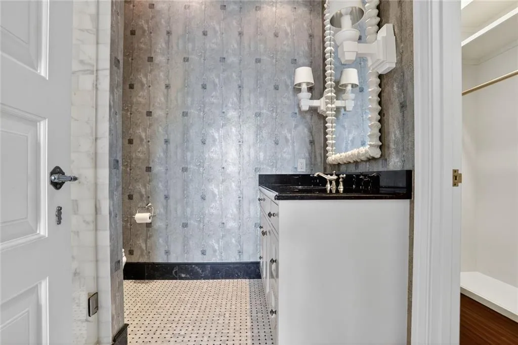 Bathroom featuring vanity and a shower stall