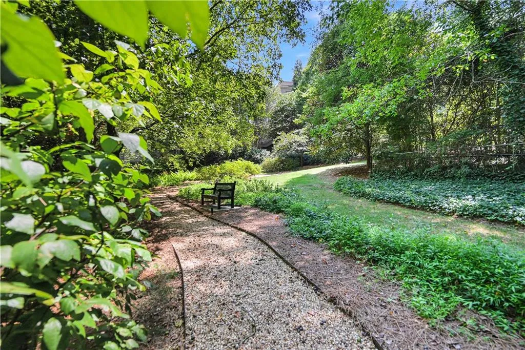 View of private greenspace and pathway behind property