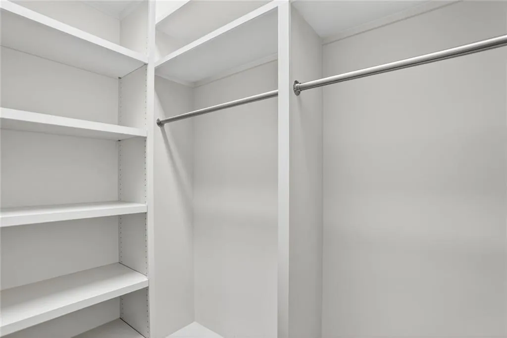 Guest Suite Bedroom 1 view of spacious closet inside the bathroom.
