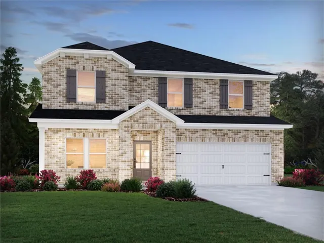 Brick facade, dark shingle roof, decorative window shutters, attached two-car garage, and a concrete driveway