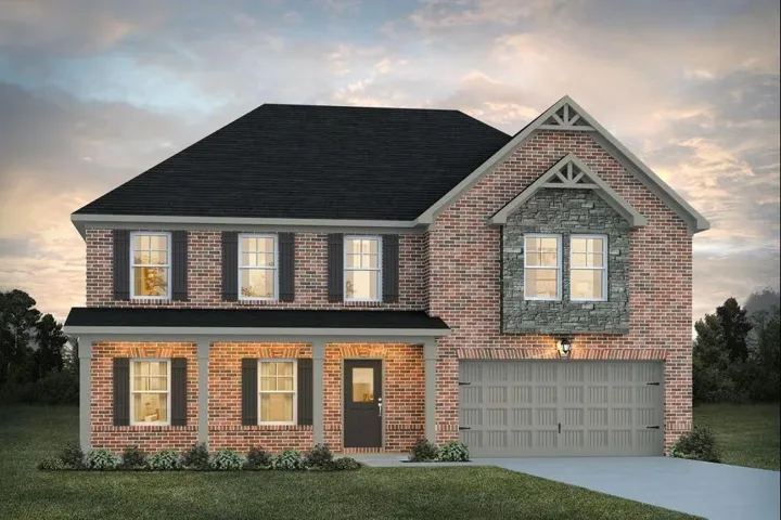 Two-story brick Colonial with a gabled entry featuring decorative timber detailing and arched transom windows