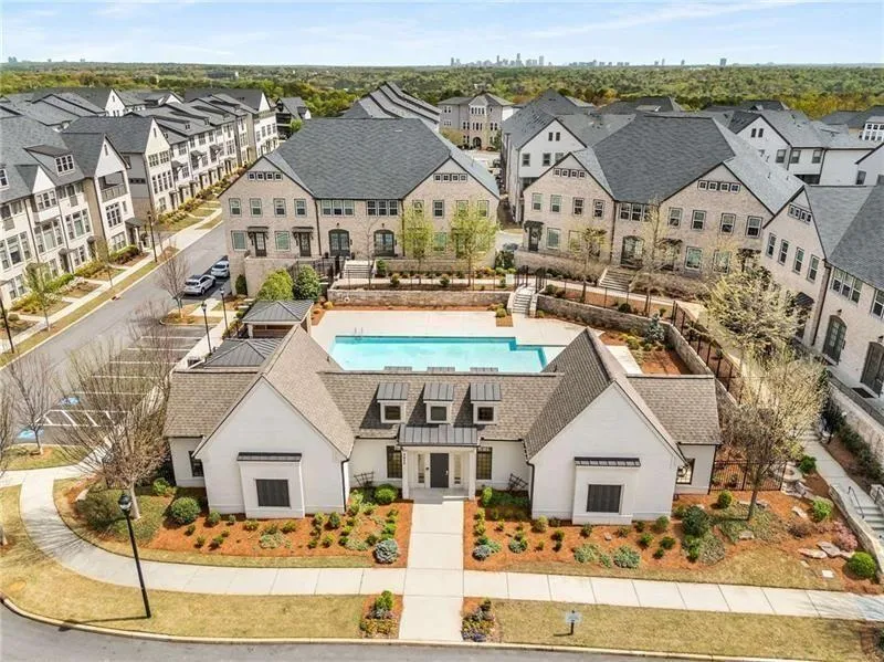 The clubhouse is pictured with the pool in the bac