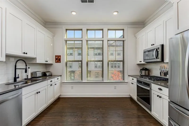 Overall layout of the kitchen - note all the windo