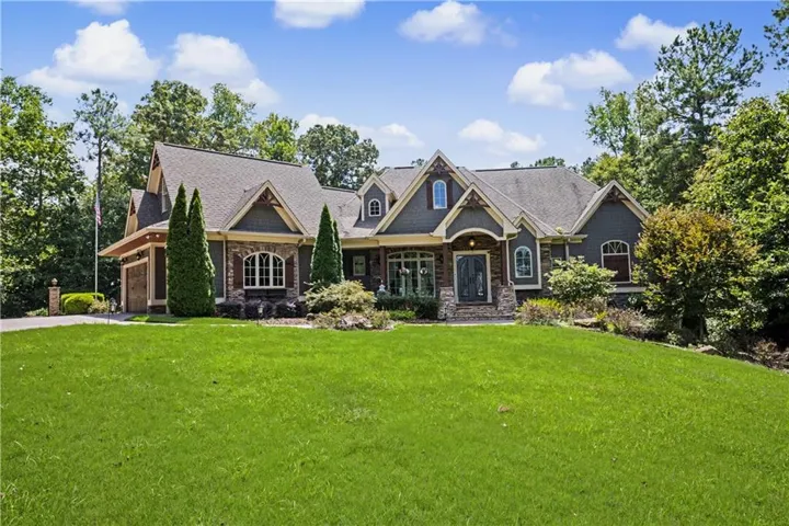 Craftsman-style exterior with stone and siding accents