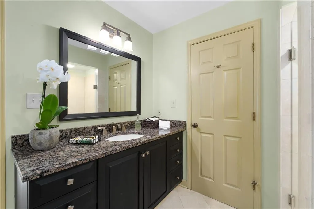 Bathroom featuring vanity and light tile patterned floors Bathroom featuring vanity and light tile patterned floors