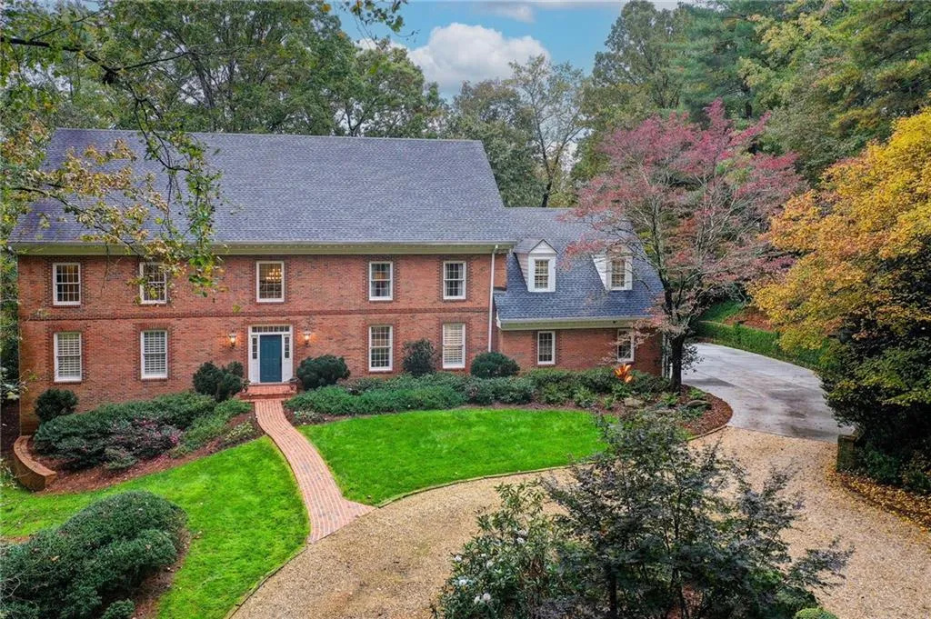 this elegant home welcomes you with a stately circular driveway, offering both grand curb appeal and everyday convenience.